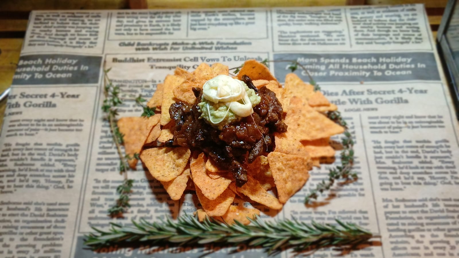 Doritos chaat topped with slow-cooked steak, guacamole and fresh herbs